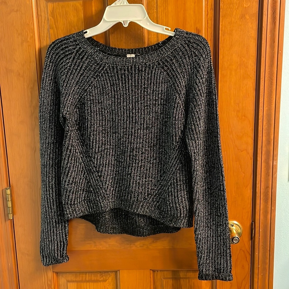 Black sweater with white detail stitching, size small
